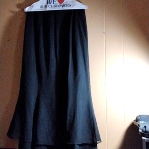 A black Adriann Papell skirt